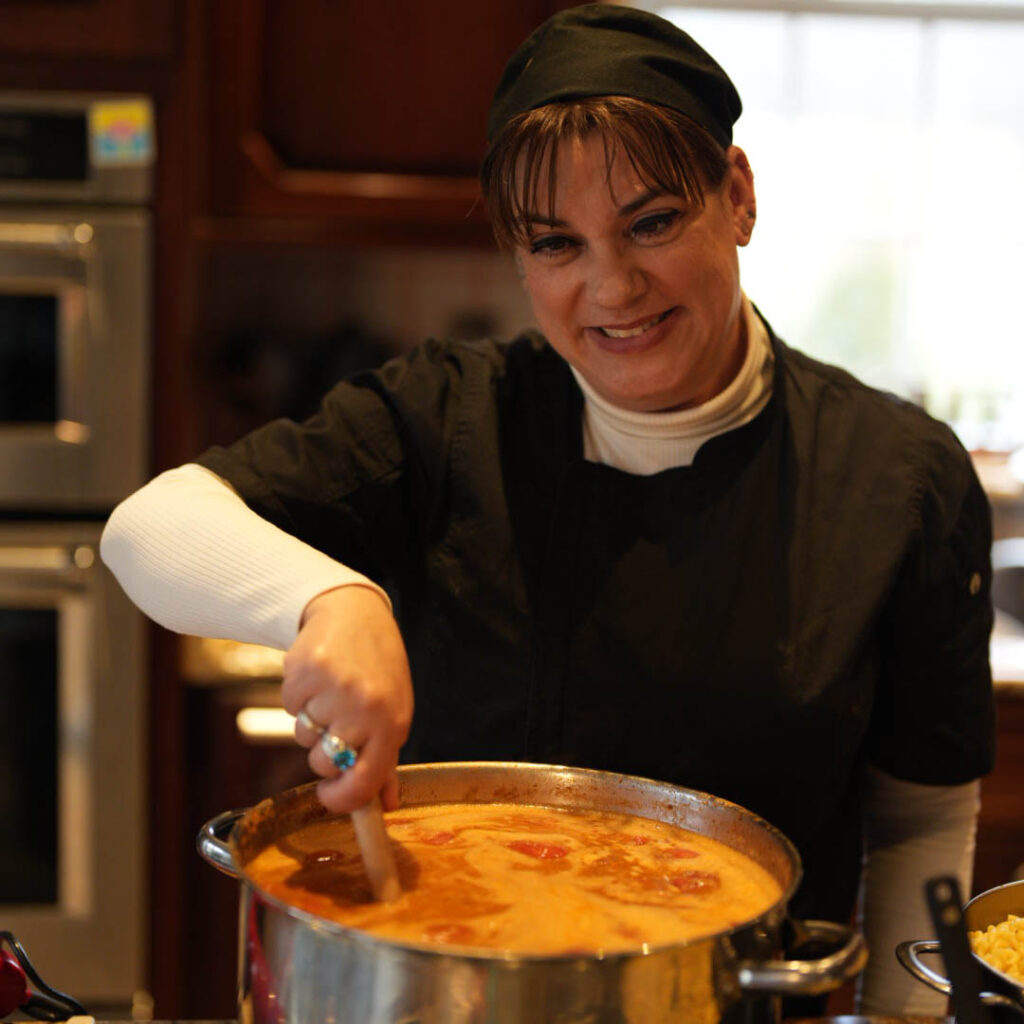 chef becky hall cooking soup in kitchen