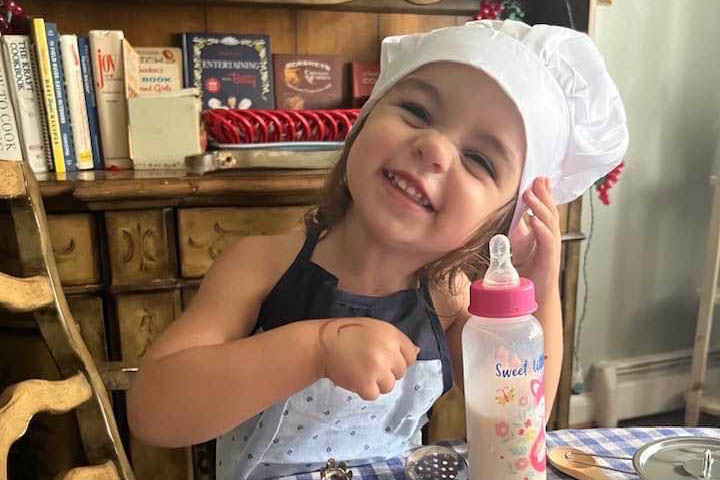 daughter wearing chef hat