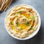 Healthy Homemade Creamy Hummus with Olive Oil and Pita Chips