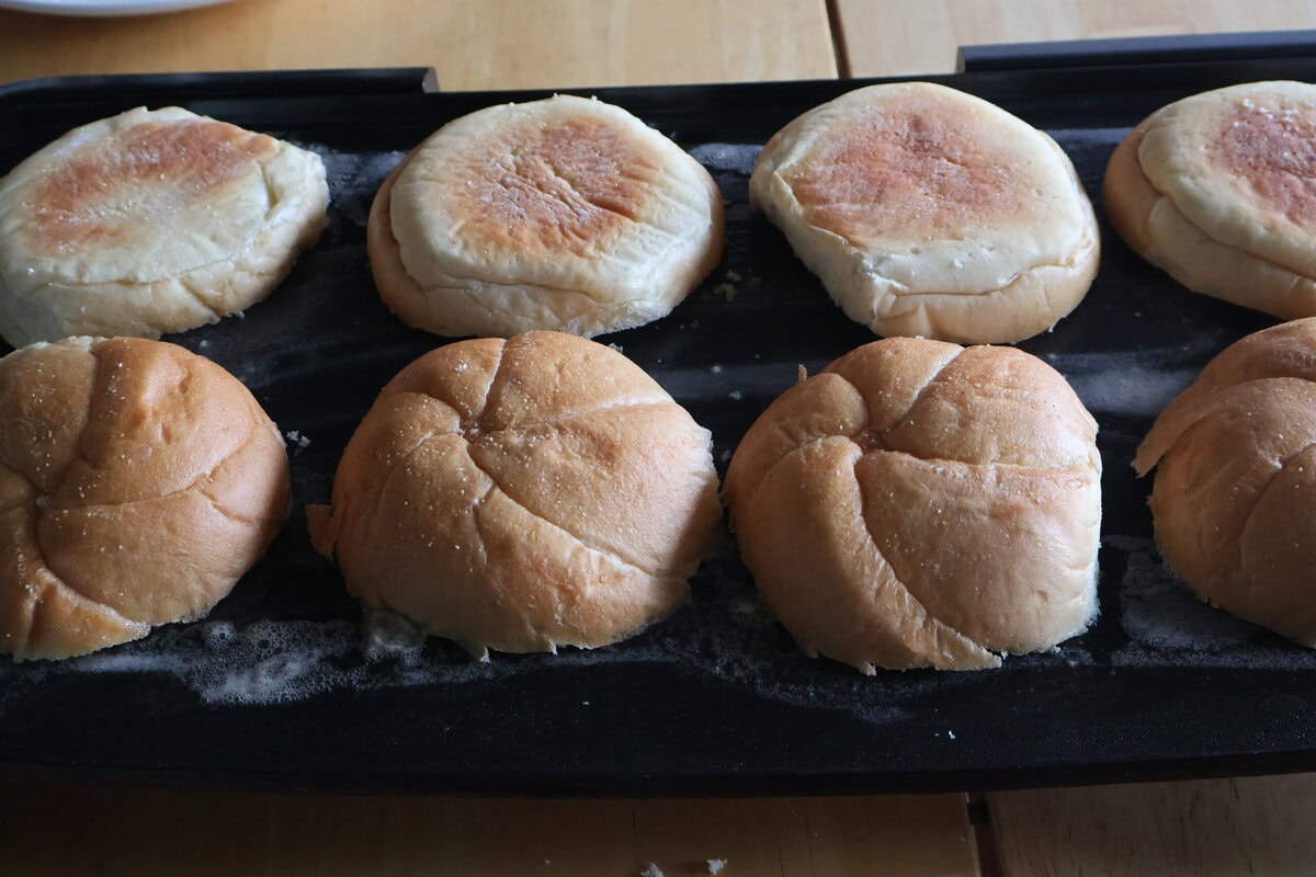 Buttered rolls on a skillet.