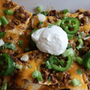sloppy joe nachos with sour cream.