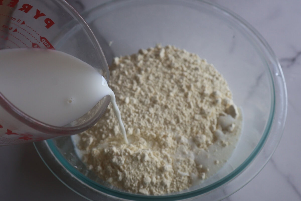 Mixing
ingredients for the blueberry muffins in a clear bowl.