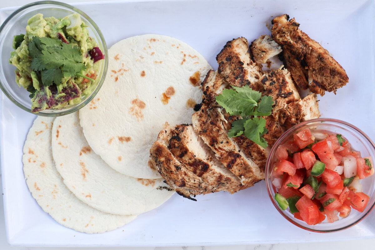 Grilled Mexican Chicken with tortillas, pico, and guac.