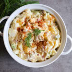 Dill Pickle Potato Salad in a white dish.