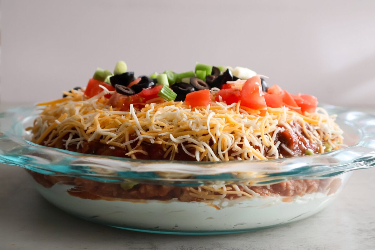 5 layer taco dip in a glass dish.
