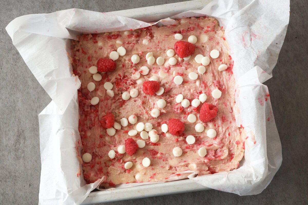 white chocolate rasberry blondies in a pan before baking.