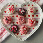 Valentine's Day Chocolate covered oreos on a heart plate.