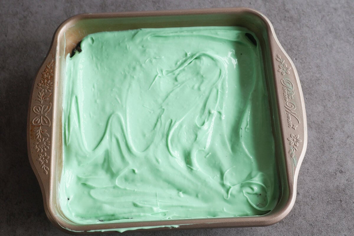 Minty green layer over top of the cookie layer.