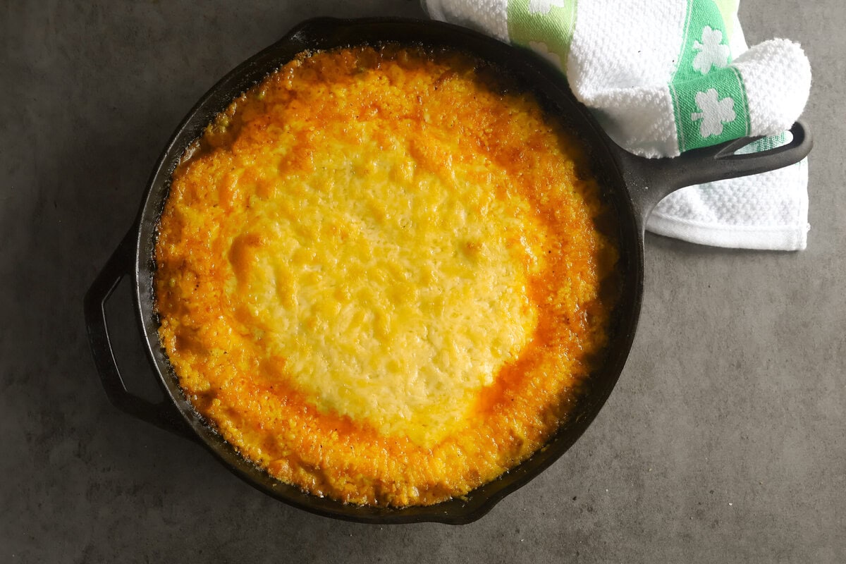 Baked Guinness Cottage Pie in a cast iron skillet.