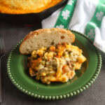 Guinness Cottage Pie on a green plate with green and white napkin.