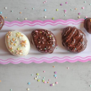Creamy Peanut Butter Easter Eggs on a white platter.