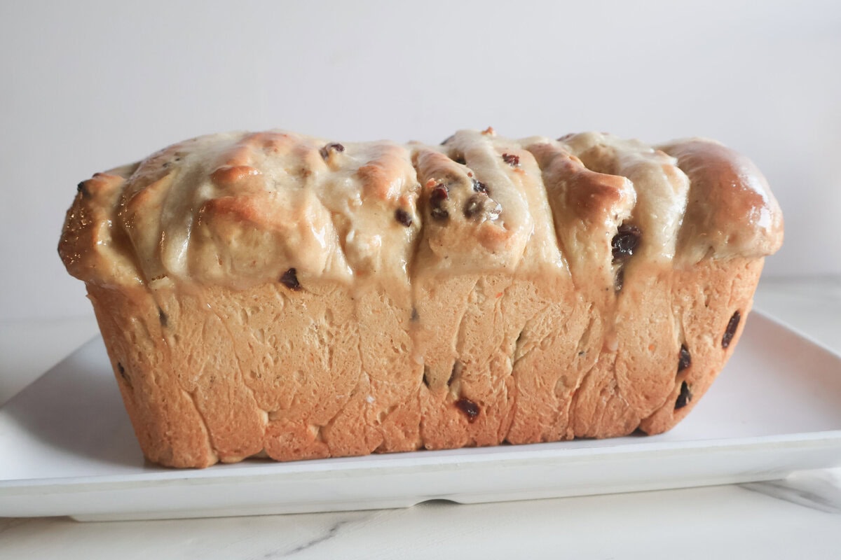 Spiced Hot Cross Buns Loaf on a white plate.