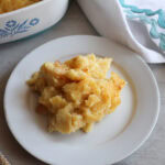 Baked pineapple on a white plate.