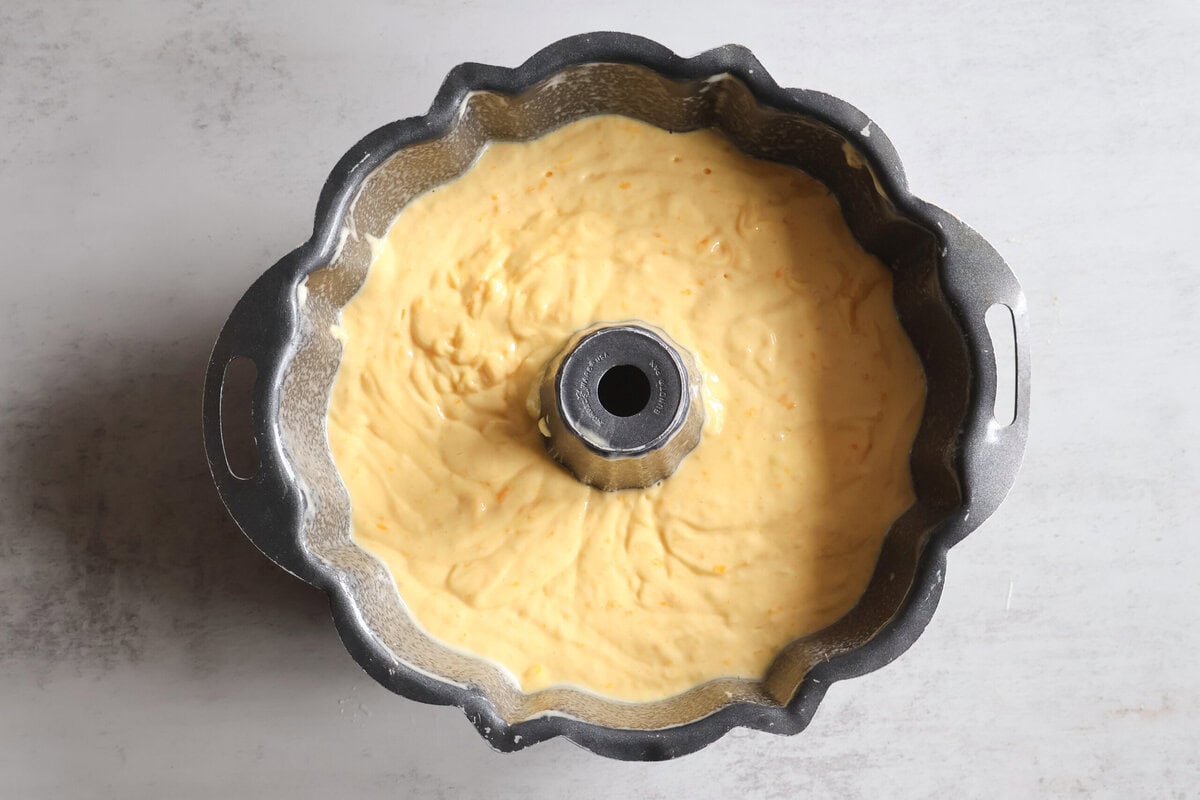 Ingredients for Mandarin Orange cake batter in a bundt pan.