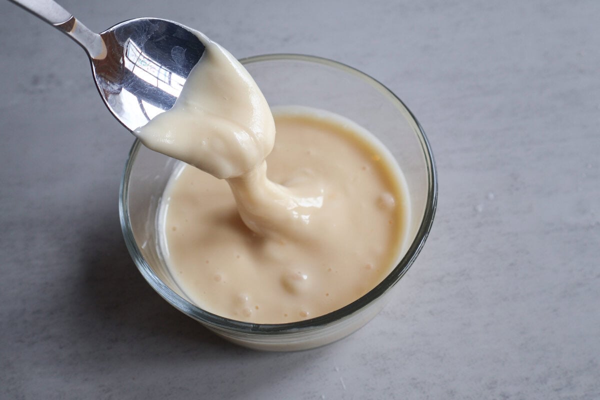 glaze in a glass dish with a spoon.
