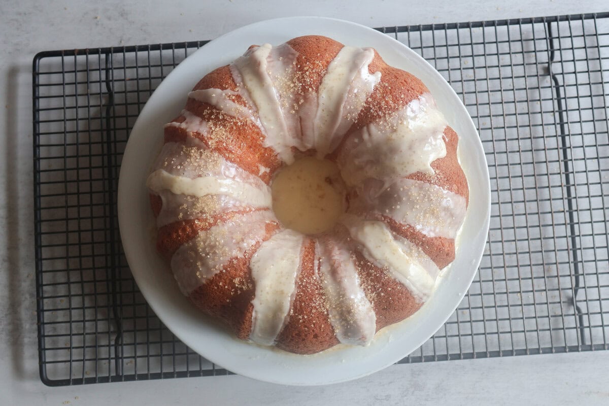 Mandarin Orange Bundt Cake On a white late and wire rack.