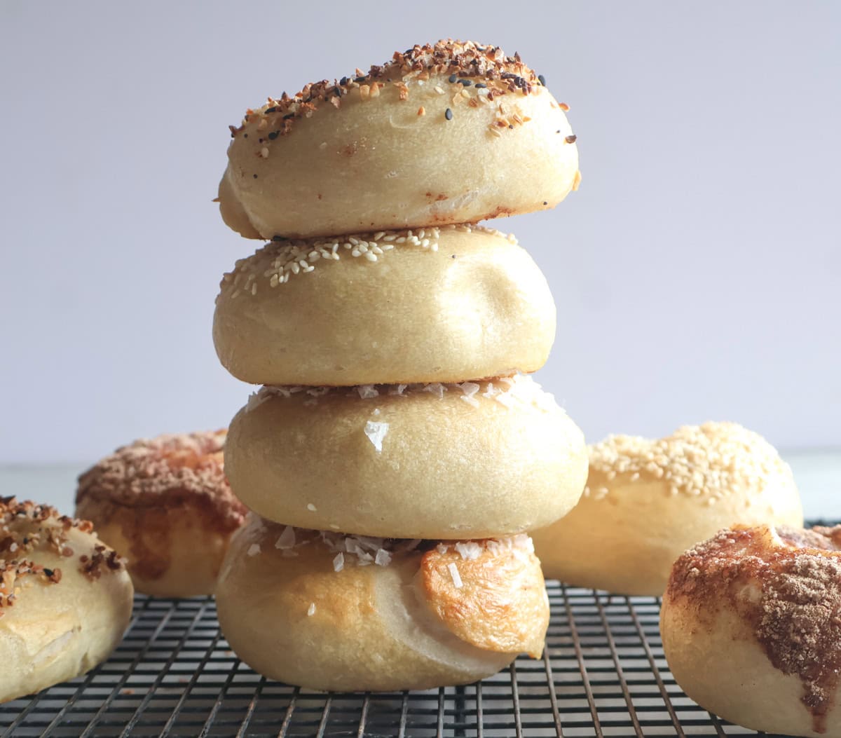 bagels stacked on a wire rack.