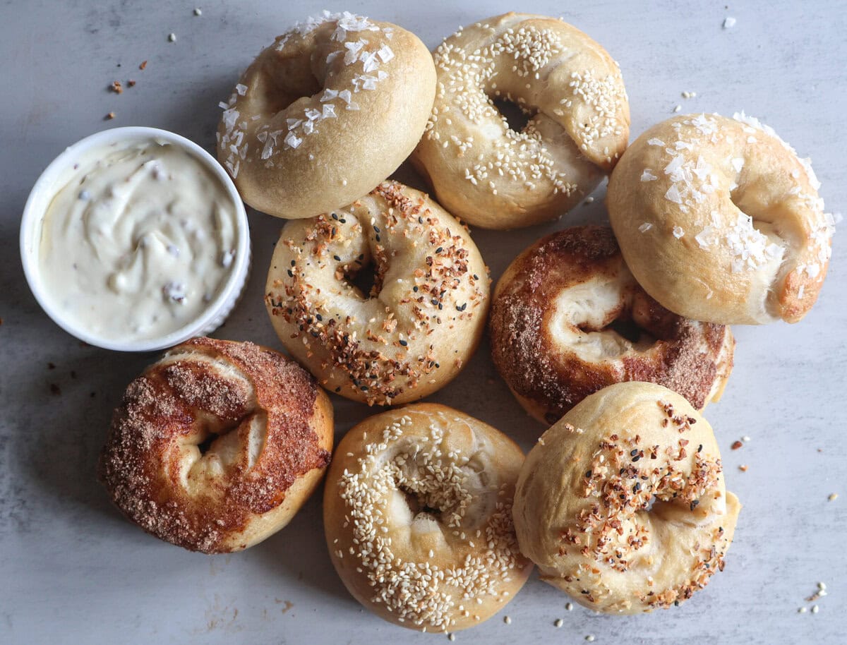 Bagels with a ramekin of cream cheese.