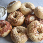 bagels with a small ramekin of cream cheese