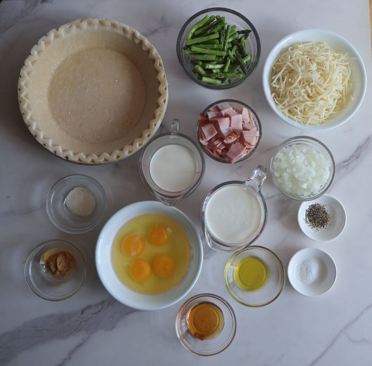 Ingredients for asparagus and ham quiche.
