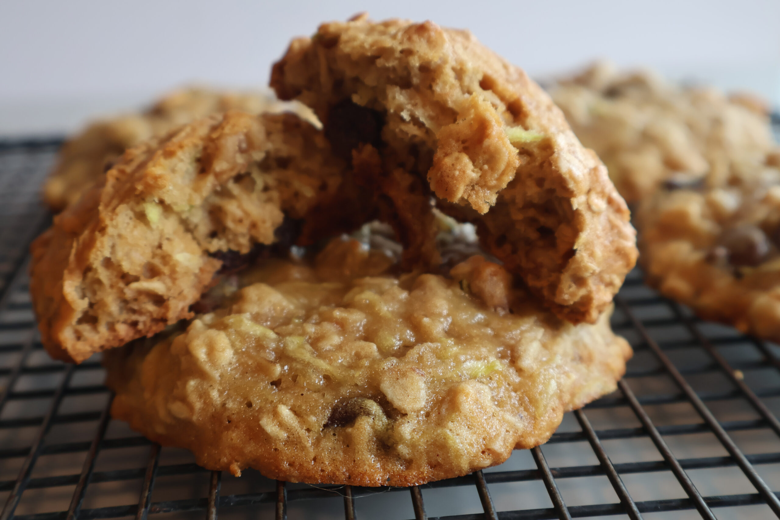 Zucchini breakfast cookies on a cooling rack close up.