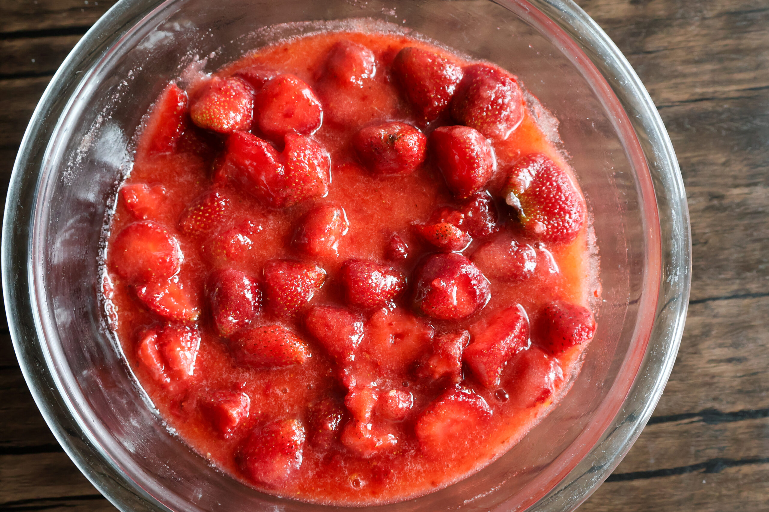 Honey strawberry preserves in a glass bowl.