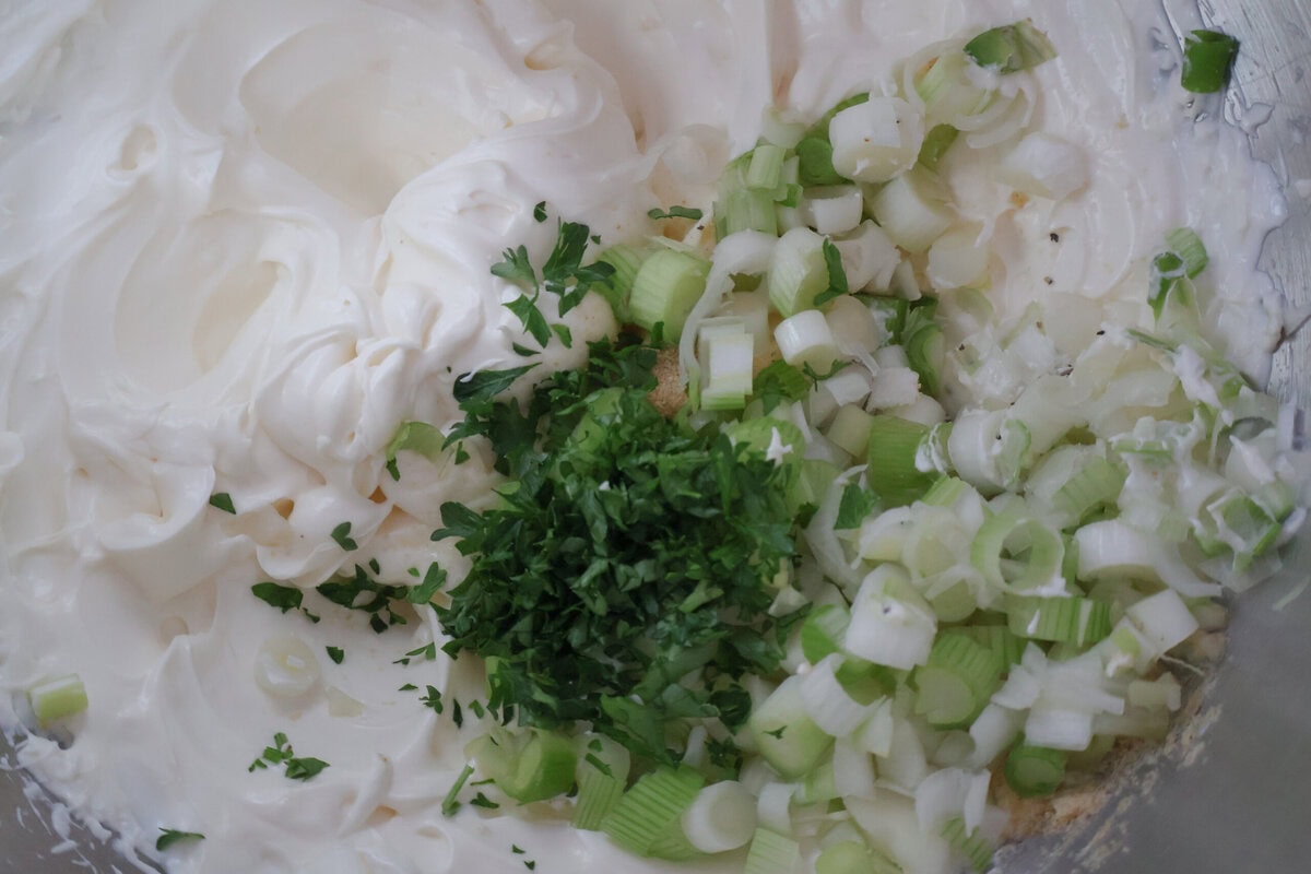 Creamy Green Onion Dip with ingredients being added.