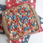 Patriotic M&M Rice Krispie Treats in a square pan.