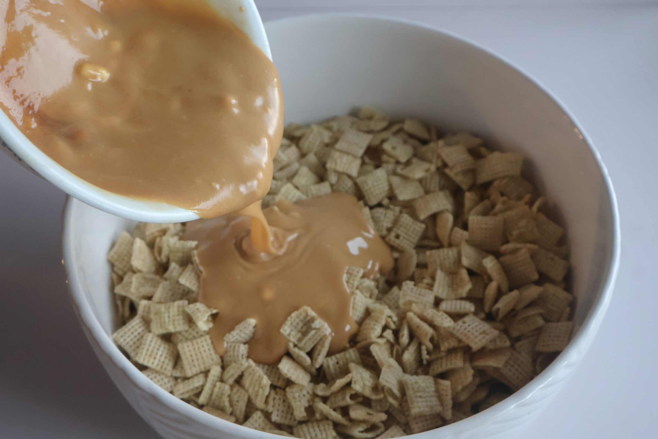 mixture being poured over the cereal.