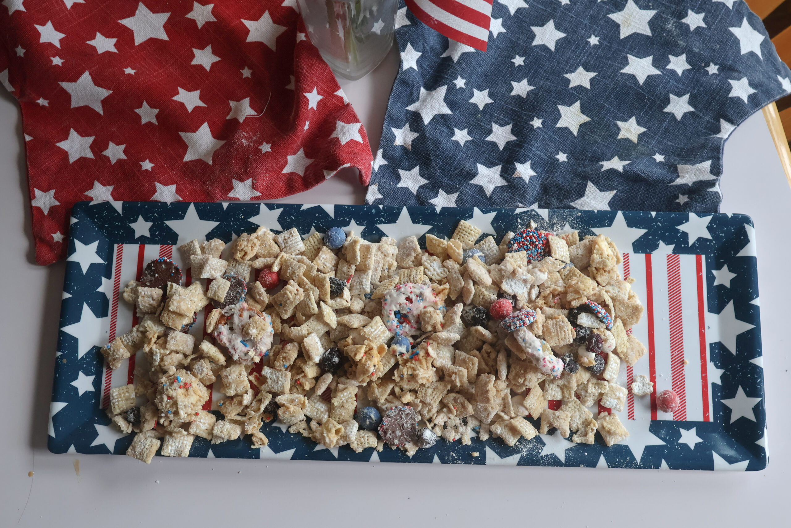 red white and blue firecracker puppy chow on a star and stripes platter.