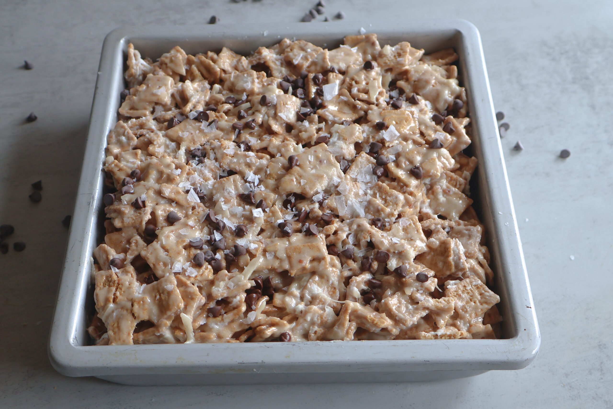 Salted honey golden grahams crunch bars in a square pan.