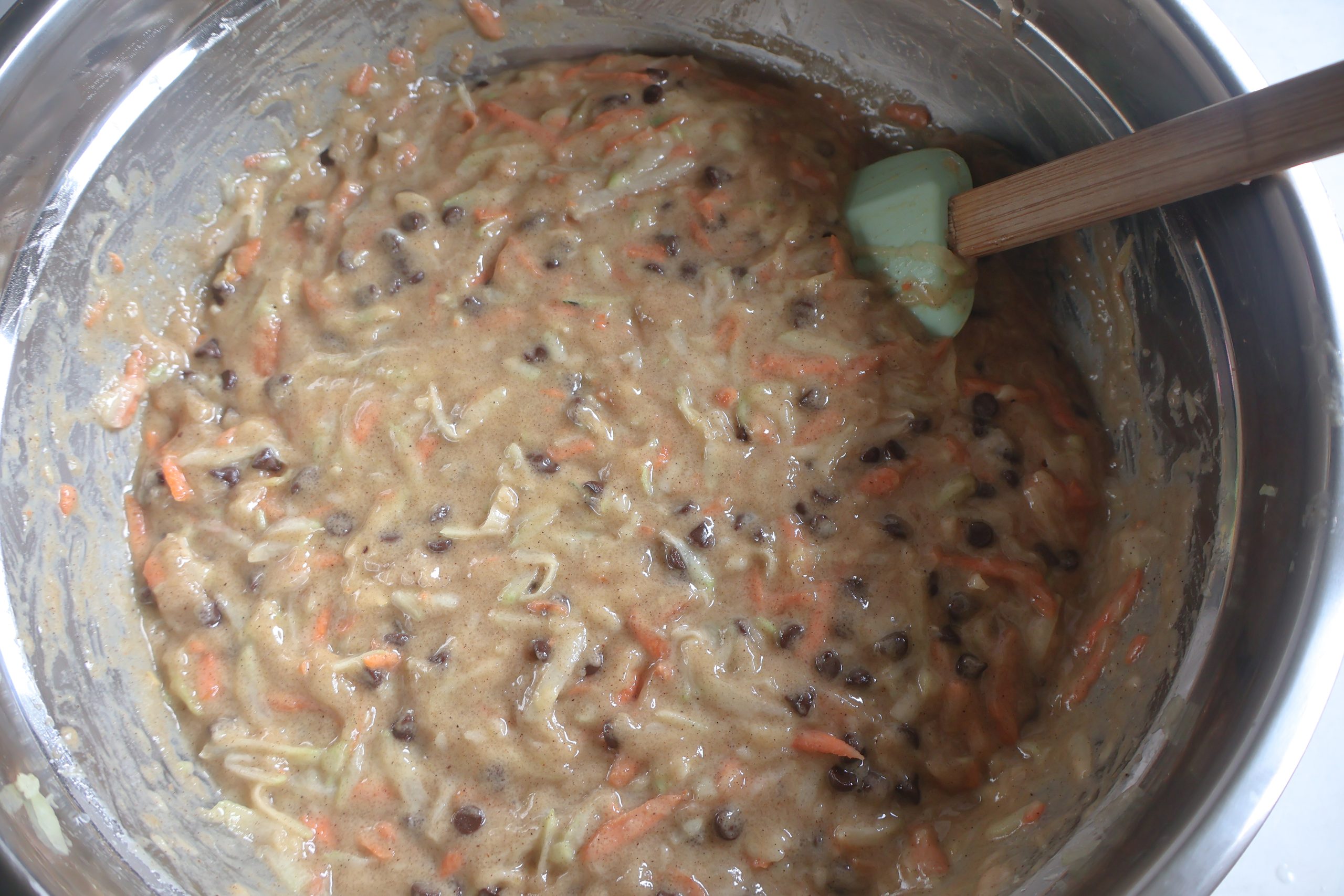 Zucchini, carrots, and chocolate chips added to the mixture.