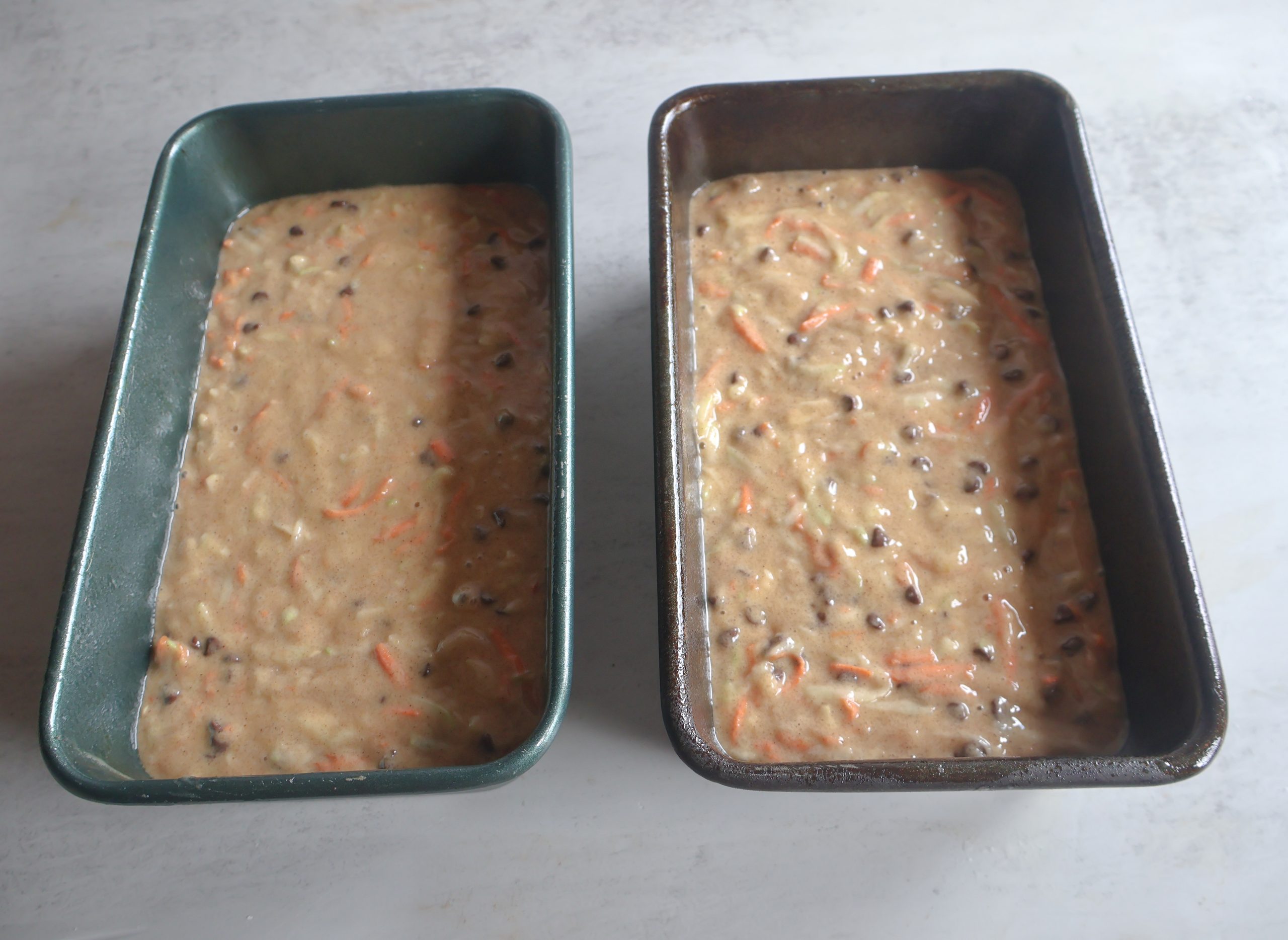 Batter divided between two loaf pans.