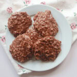 chocolate peanut butter no bake cookies on a plate.