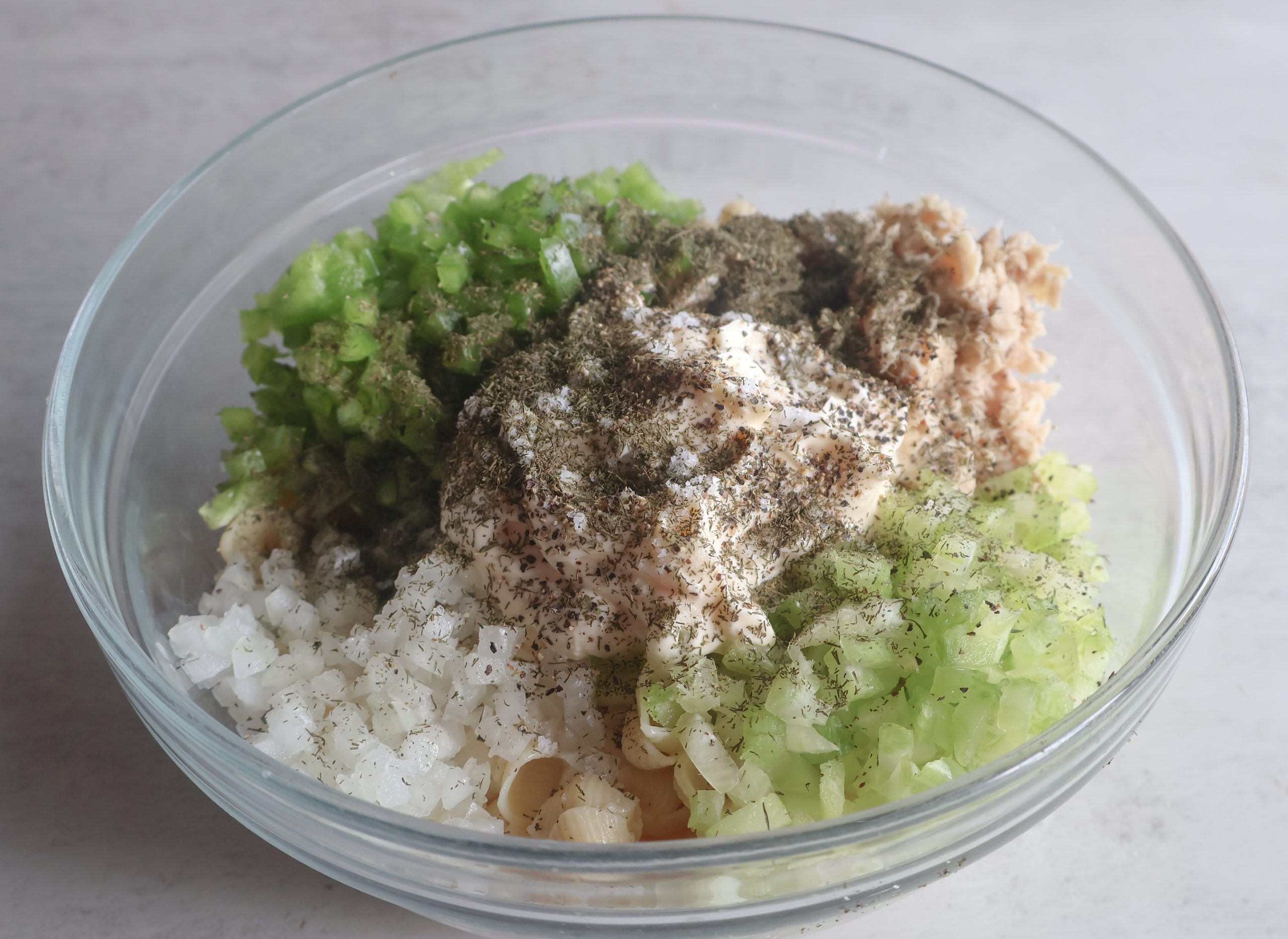 Creamy Tuna Pasta Salad with ingredients added.