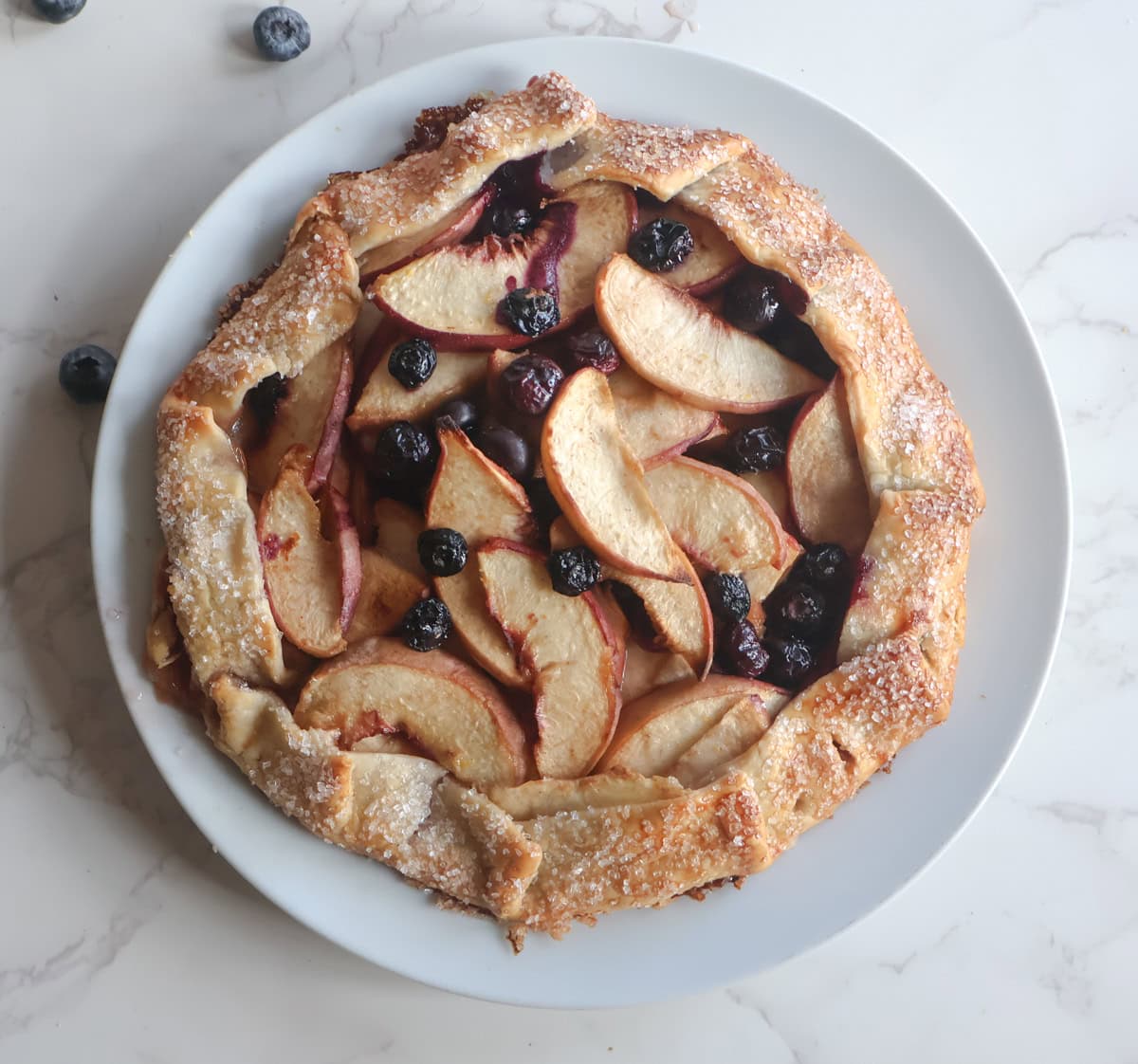 Blueberry Peach galette on a white plate.