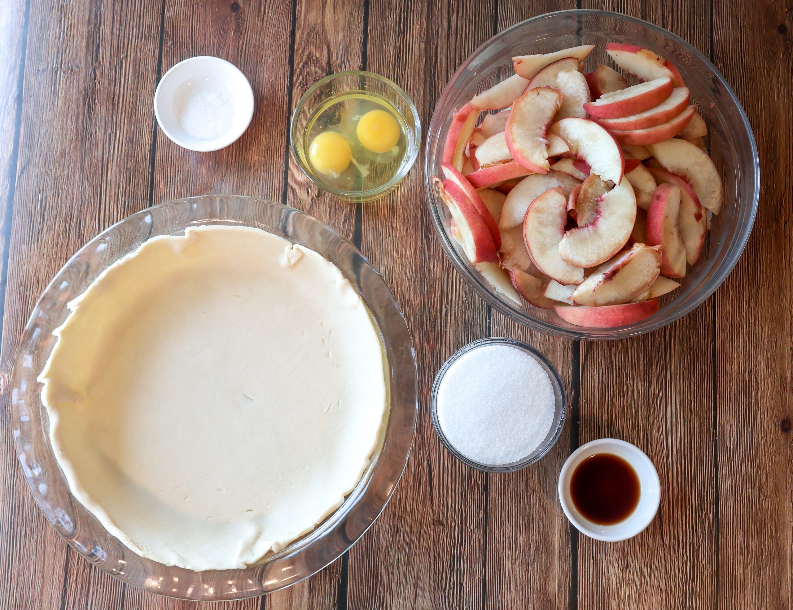 Ingredients for fresh peach custard pie.