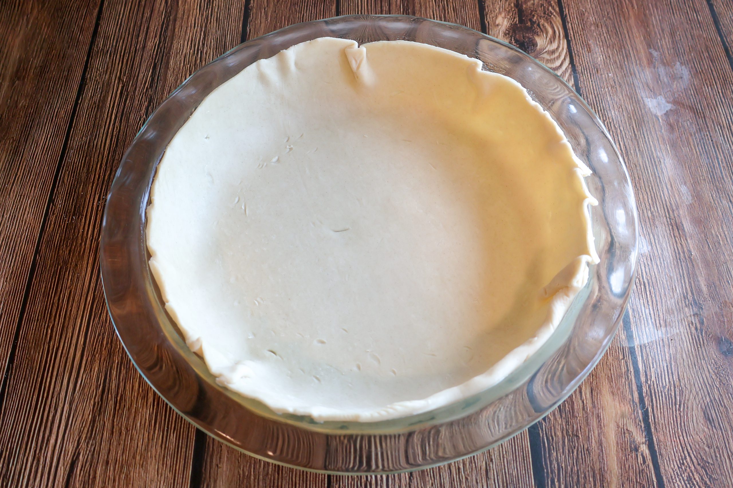 Pie crust in a pie plate.