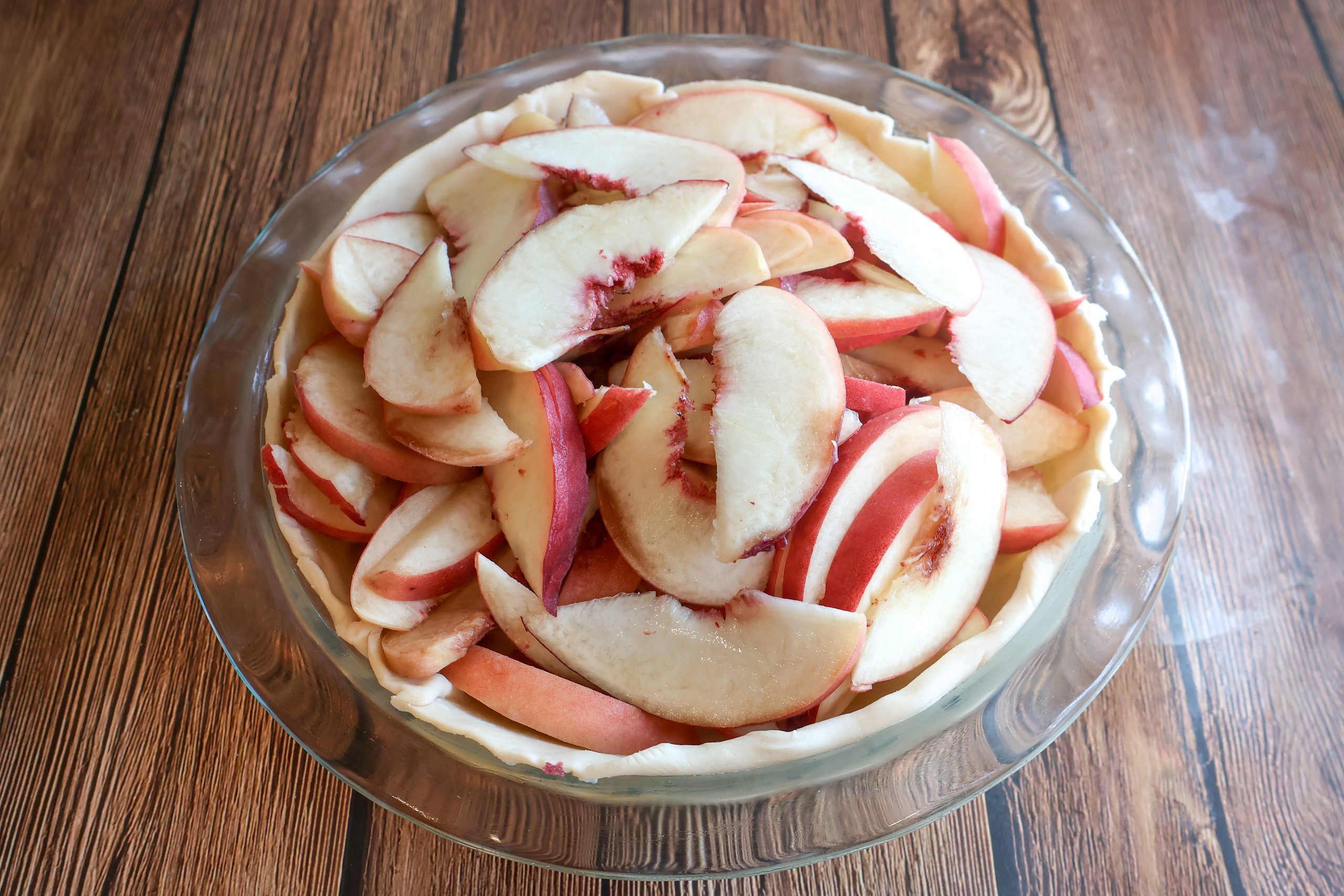 Fresh peaches in a pie crust.