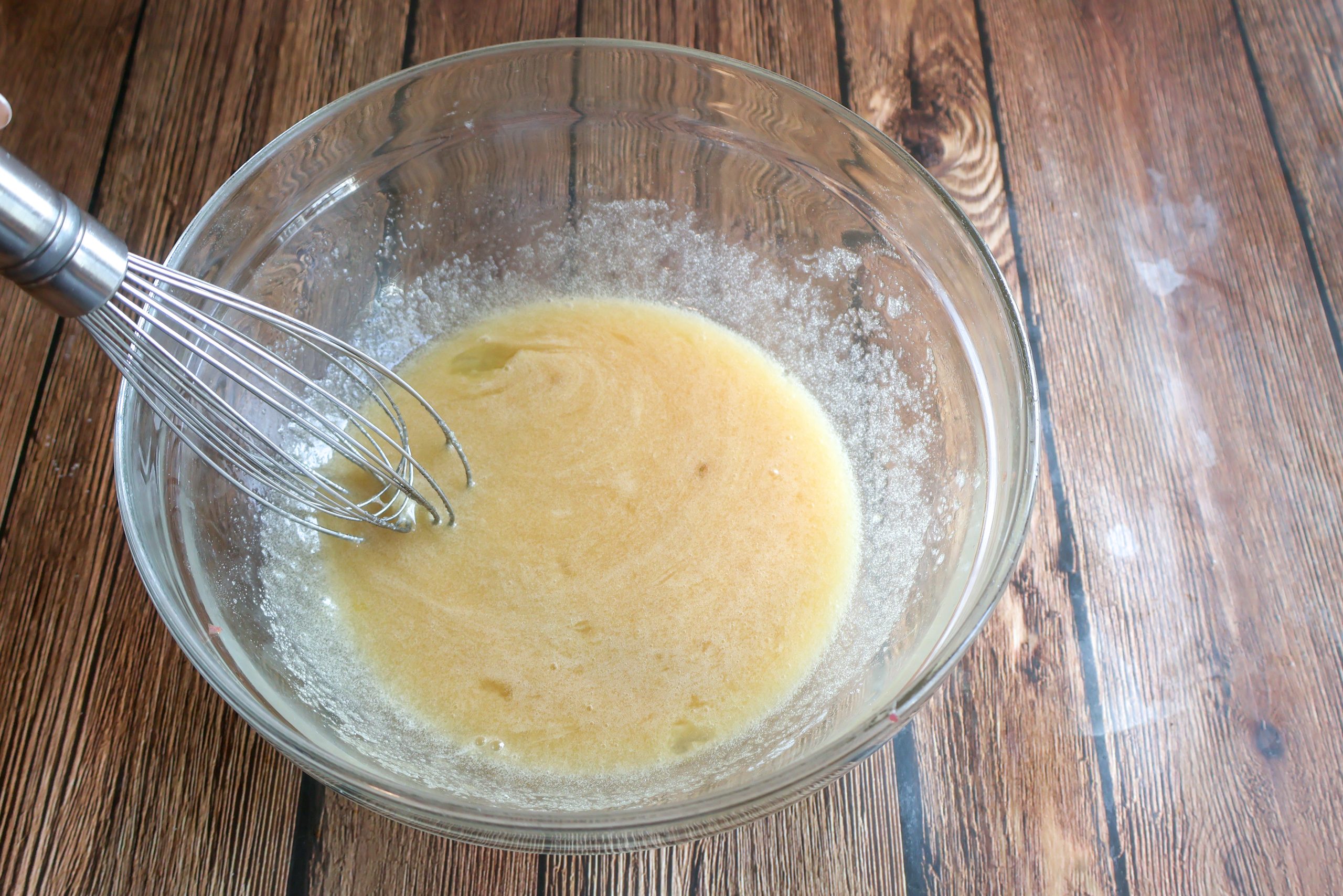 custard mixed into a glass bowl.