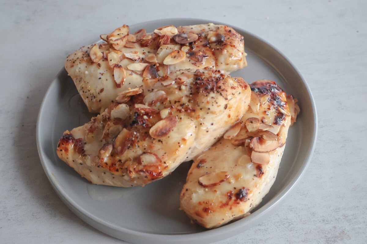 Vidalia onion almond chicken on a gray plate.
