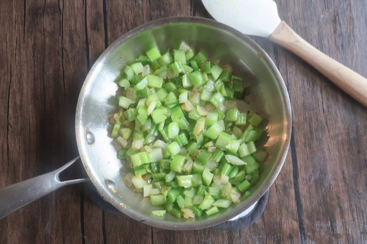 onion and peppers in a pan for the baked chicken salad.