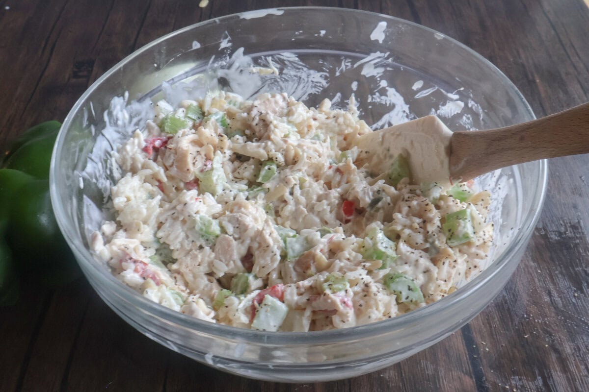 filling for the baked chicken salad mixed in a bowl.