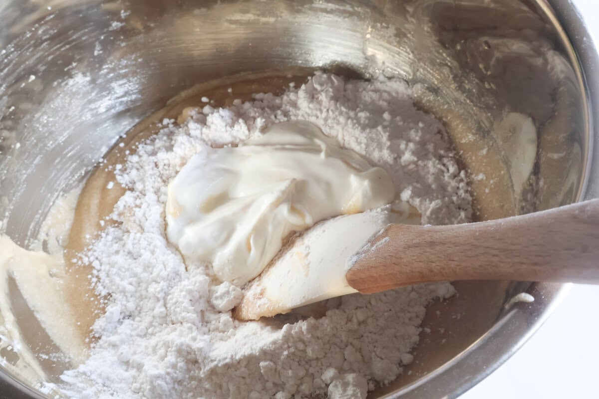 dry ingredients being added to the wet ingredients.