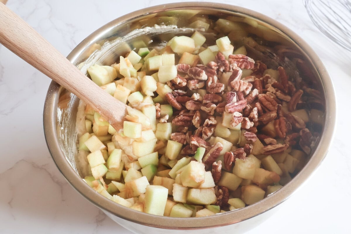 apples and walnuts added to the apple cake mixture.
