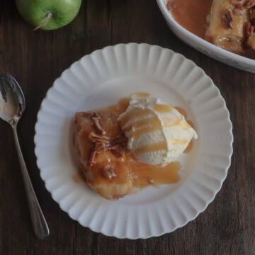 easy caramel apple dumplings with ice cream on a white plate with a fork.