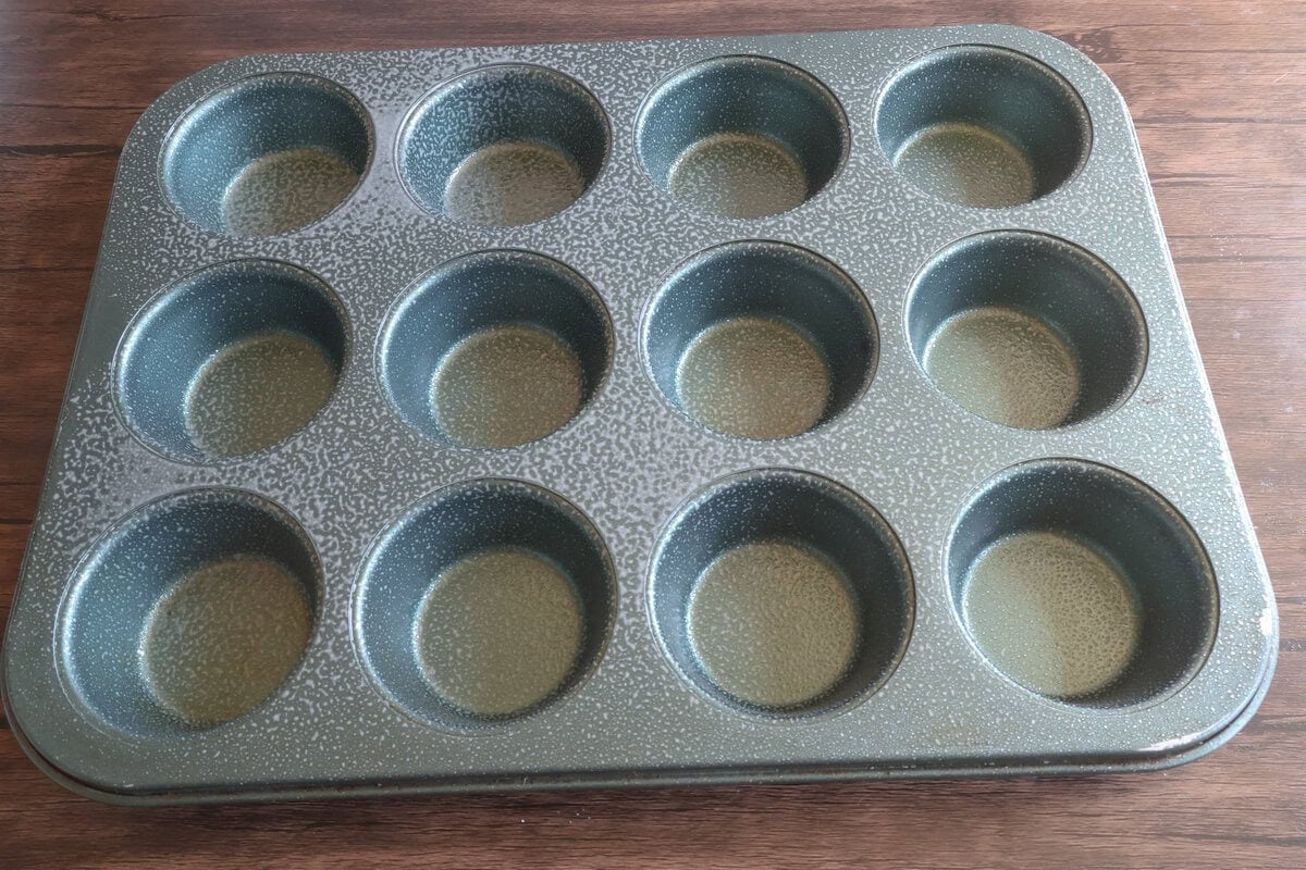 Greased muffin pan for the apple cider donut muffins.