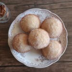 apple cider donut muffins on a plate.