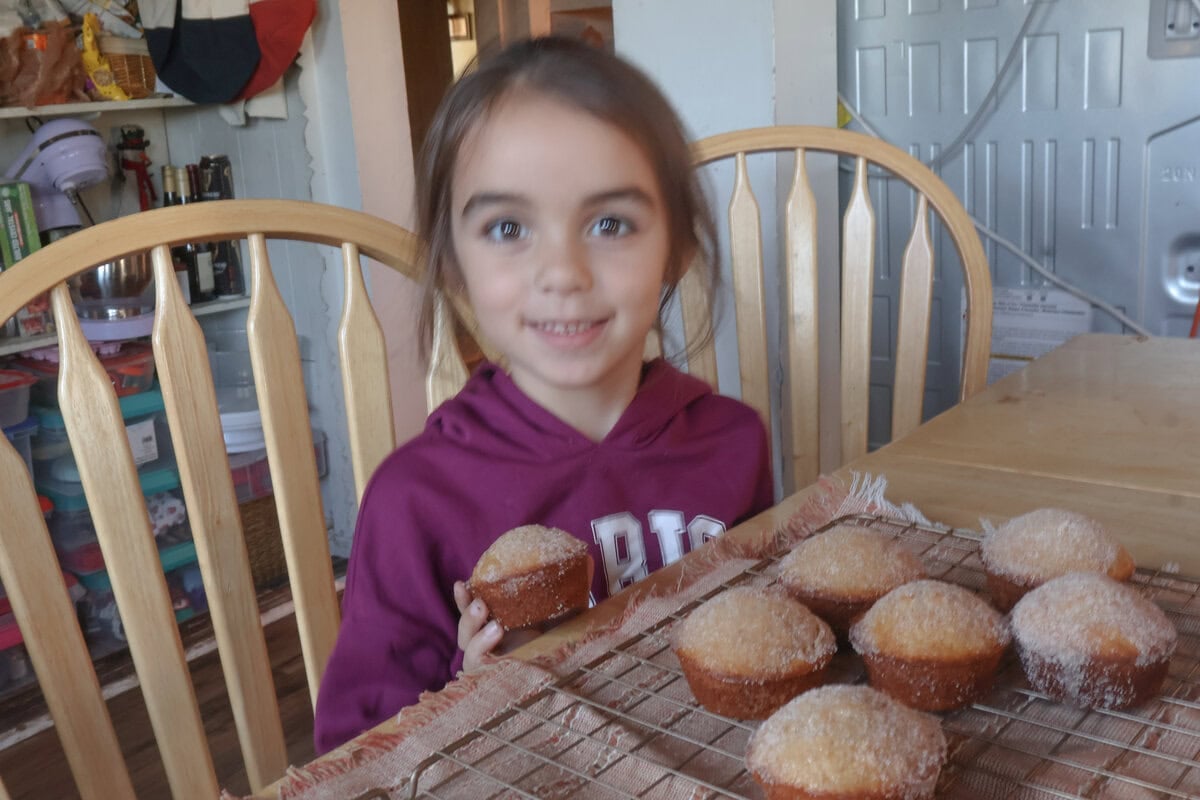 My daughter enjoying the apple cider donut muffins.