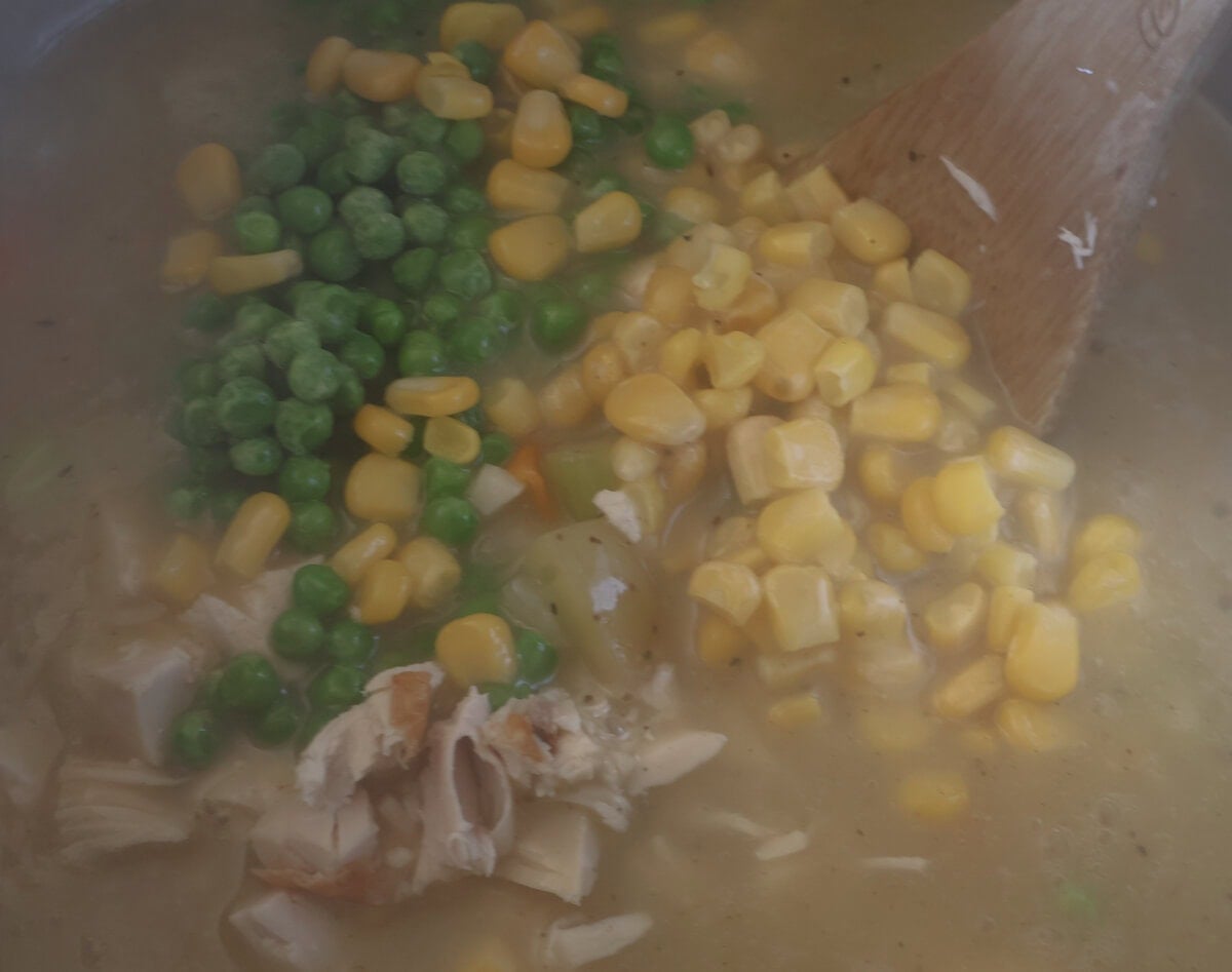 vegetables and chicken added to the creamy chicken pot pie soup.